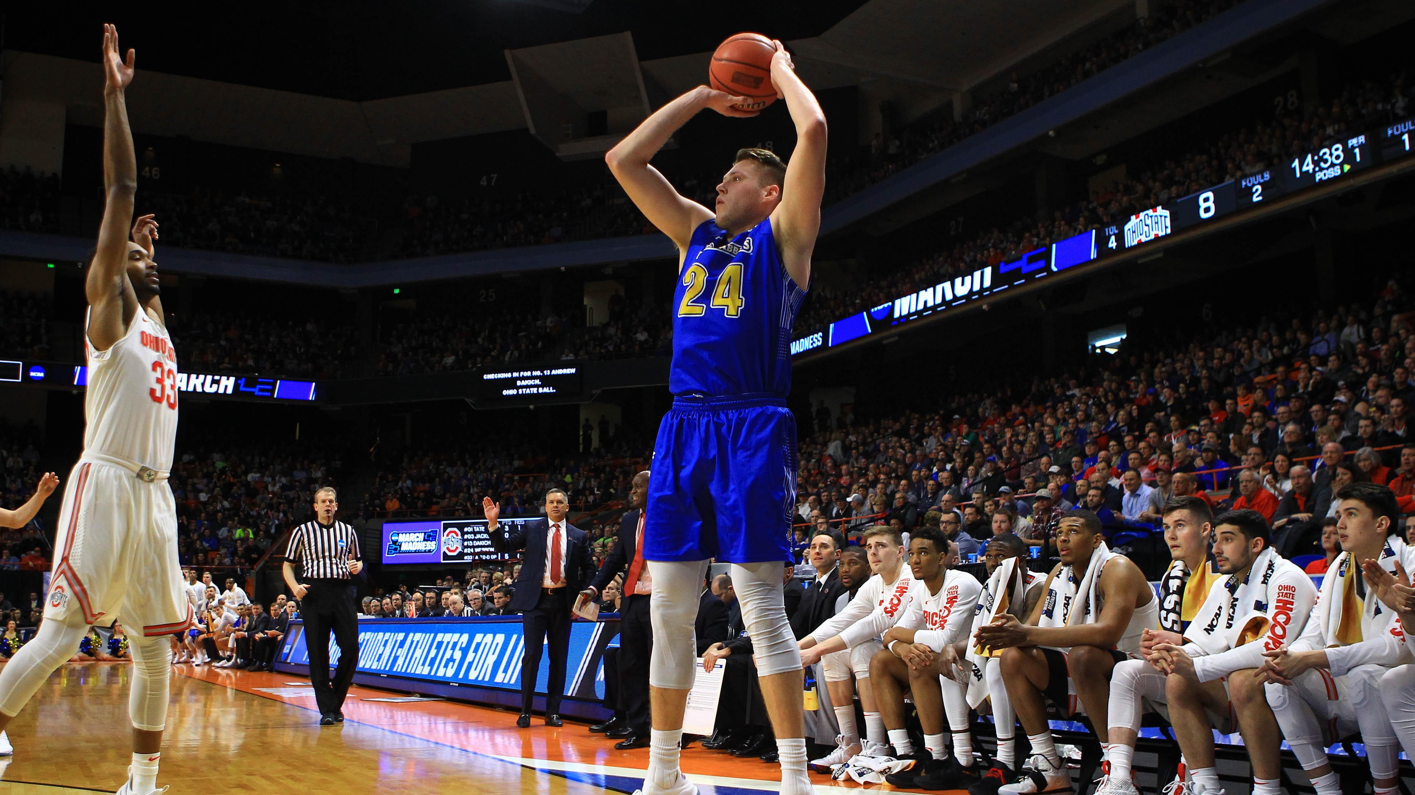 South Dakota State's Mike Daum takes a three